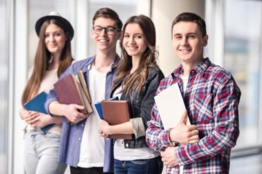 group-happy-young-students-university_85574-4531